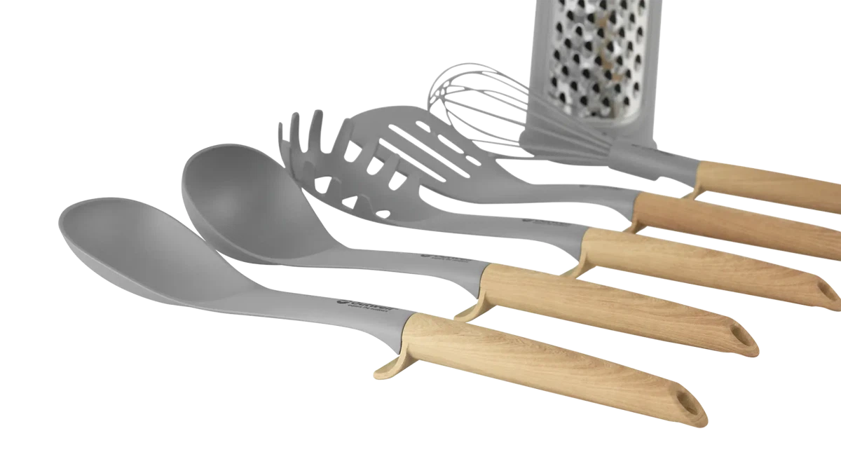 Outwell Adana utensil set with wooden handles and stainless steel tools for kitchen use, displayed on a white background.