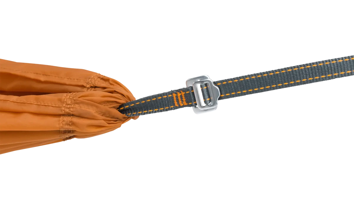 Robens Trace Hammock UL camping accessory shown hanging between trees, lightweight and durable for outdoor camping adventures.