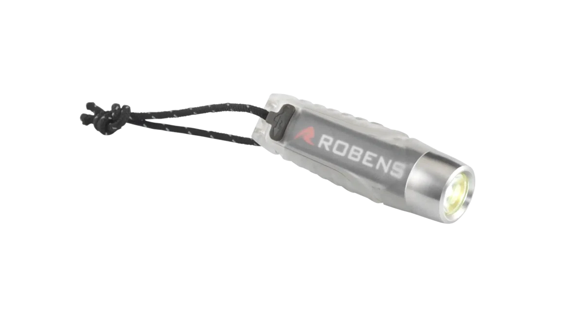 Robens Assynt Flashlight UL accessory with compact design, black exterior, and adjustable strap for outdoor camping use.