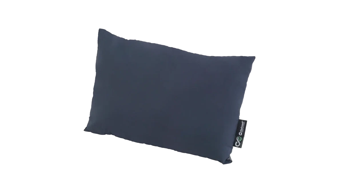 Outwell Comfort Pillow resting on a bed, soft and supportive outdoor camping pillow for restful sleep.