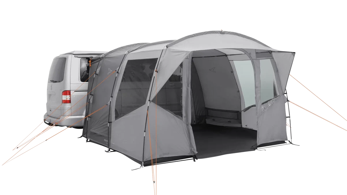 Easy Camp Reine drive-away van awning set up on a vehicle, showcasing its spacious fabric extension and durable design.
