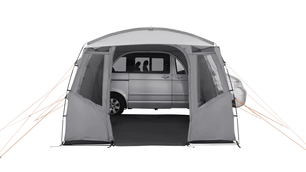 Easy Camp Reine drive-away van awning set up outdoors, showing its spacious fabric shelter and adjustable support poles.