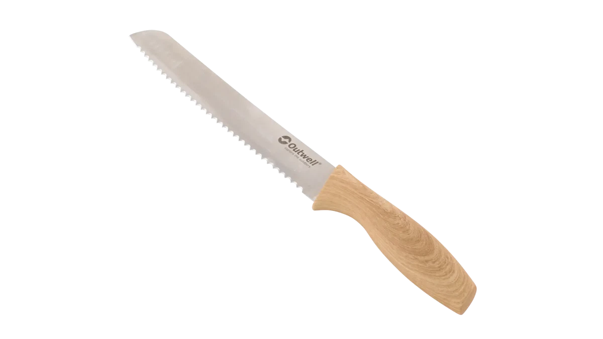 Outwell Caldas knife set with cutting board, including various kitchen knives and a wooden chopping board, for meal prep and cooking.