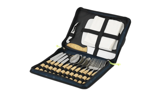 Outwell Morella Picnic Cutlery Set with stainless steel knives, forks, and spoons arranged on a table for outdoor dining.