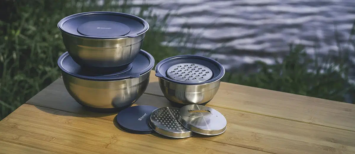 Outwell Chef Bowl Set with lids and graters, kitchenware including colorful bowls for cooking and food preparation.