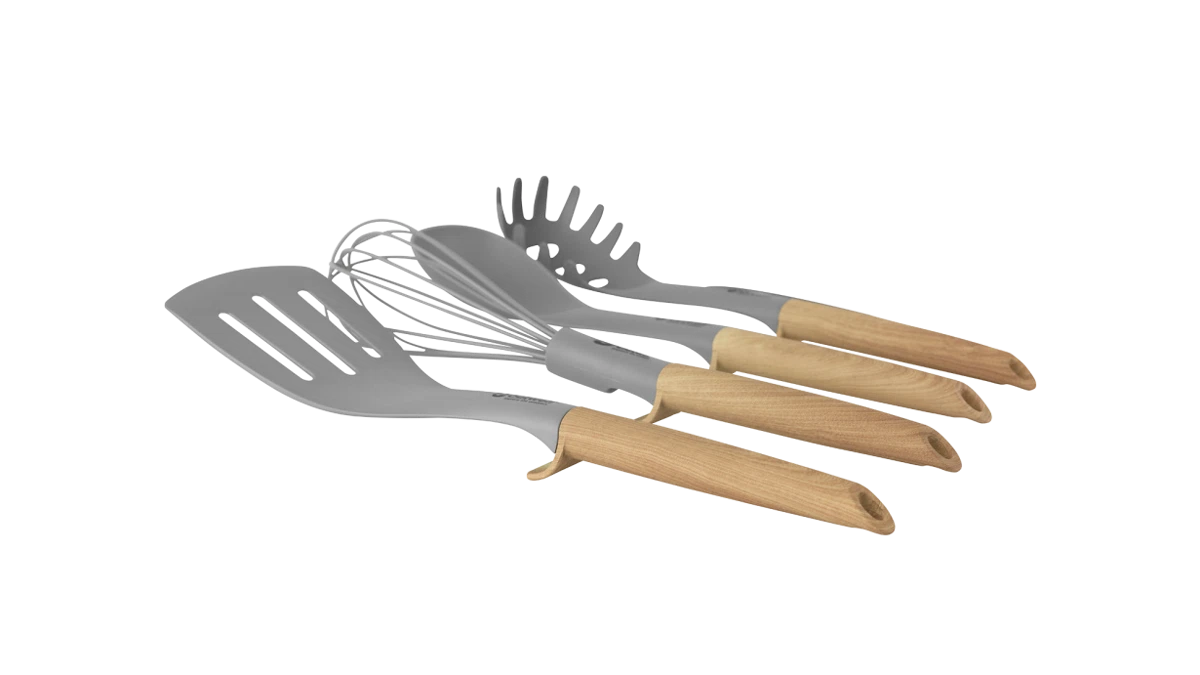 Outwell Almada Utensil Set for kitchen, featuring stainless steel spoons, spatulas, and tongs arranged on a wooden surface.