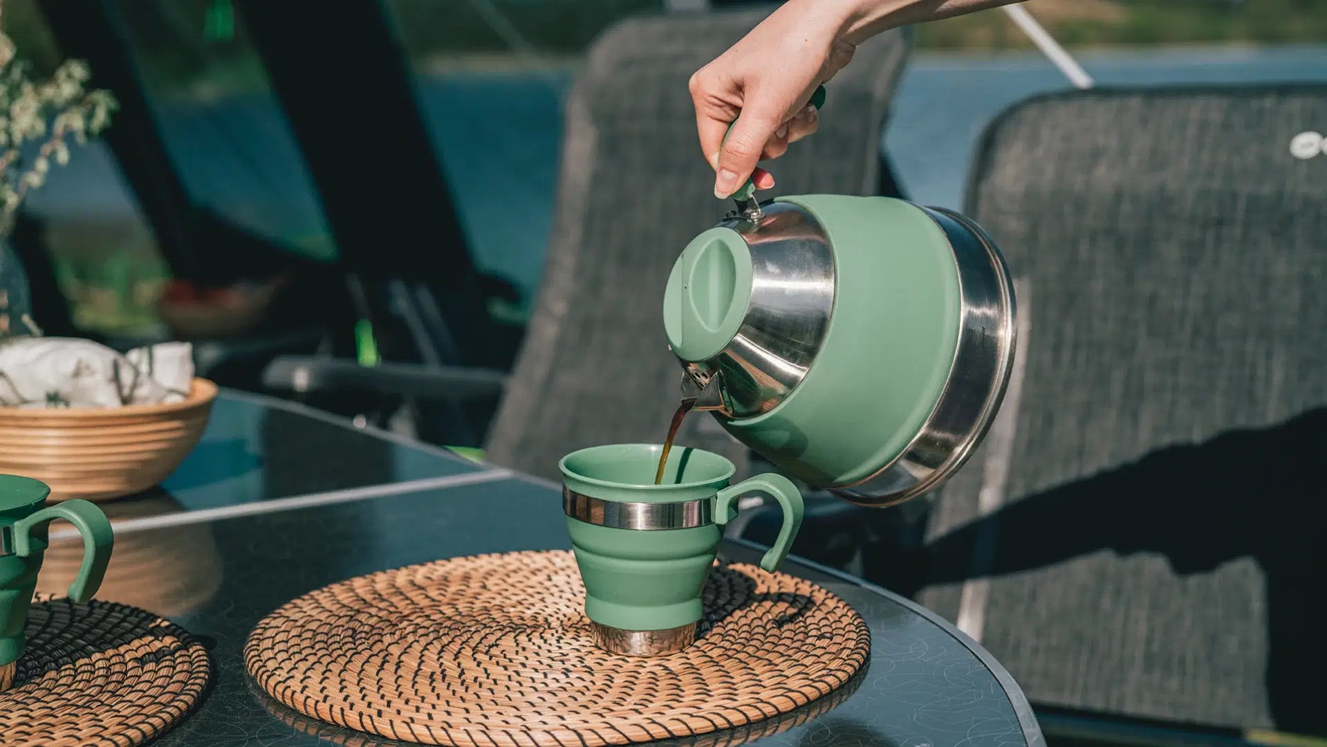 Outwell Collaps Kettle 2.5L in navy, compact outdoor camping accessory by Summit Sanctuary, shown in a folded, portable state