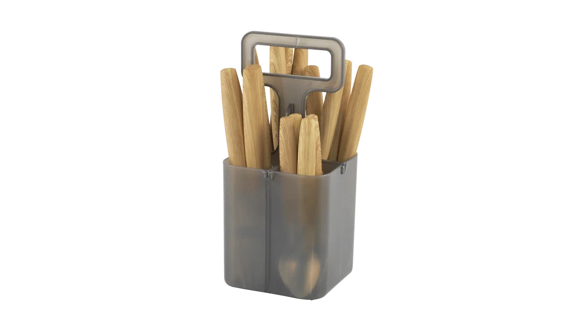 Outwell Cordona Box cutlery set with stainless steel forks, knives, and spoons arranged in a compact tableware storage box.