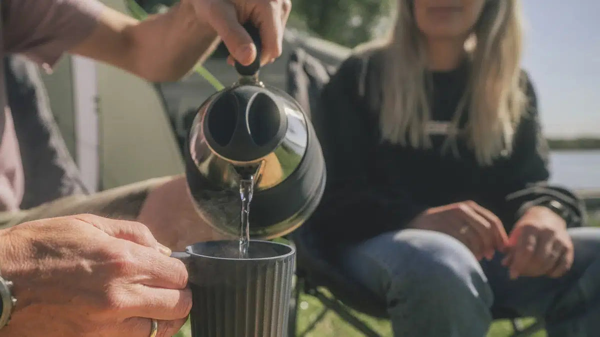 Outwell Collaps Kettle 1.5L in navy blue, compact and foldable design for camping and outdoor use.