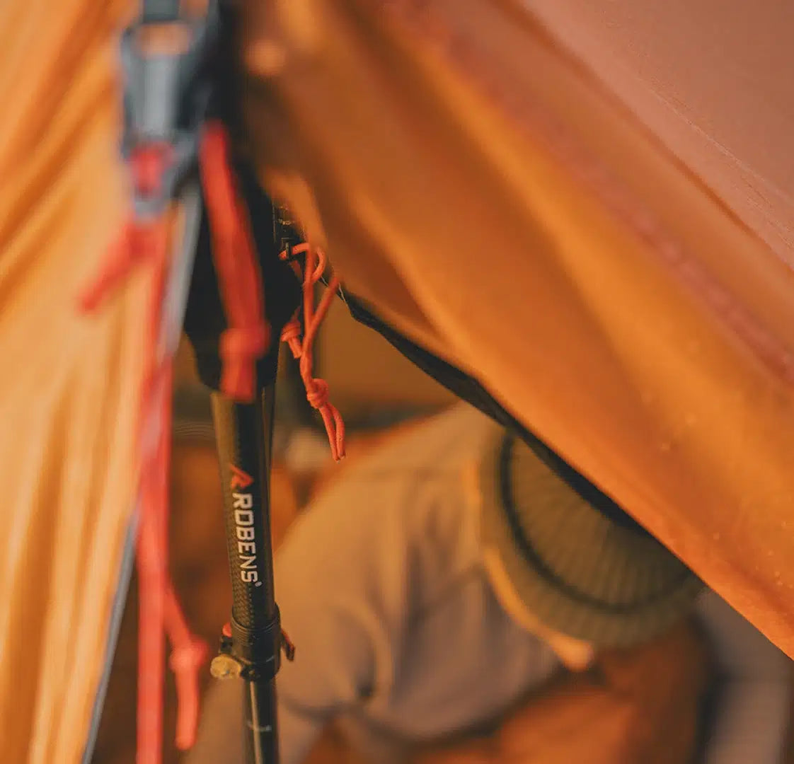 Robens Via 1 UL trekking pole tent set up outdoors, lightweight single-person camping tent with rainfly and ventilation features.