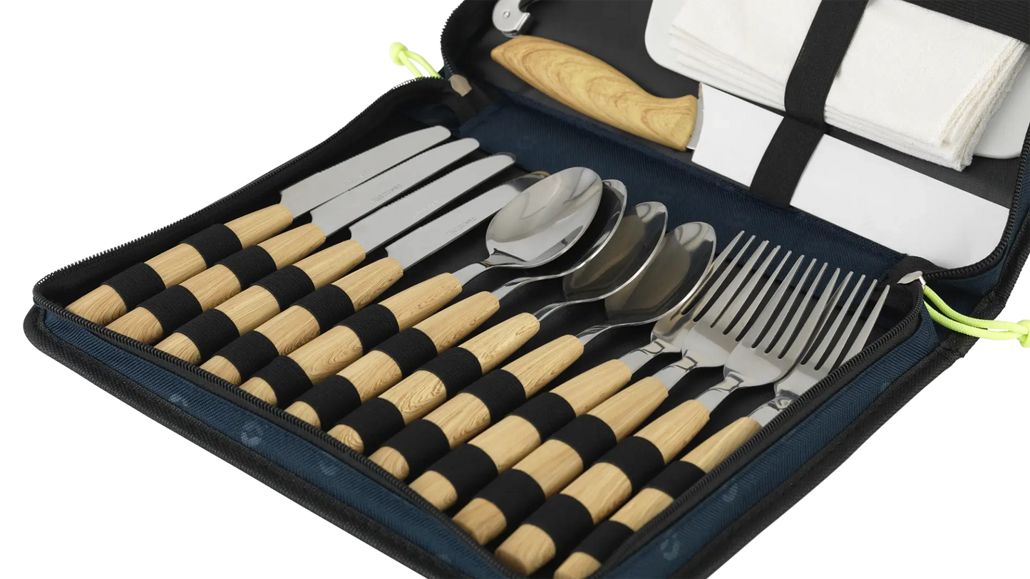 Outwell Morella picnic cutlery set with stainless steel knives, forks, and spoons arranged on a wooden table for outdoor dining.
