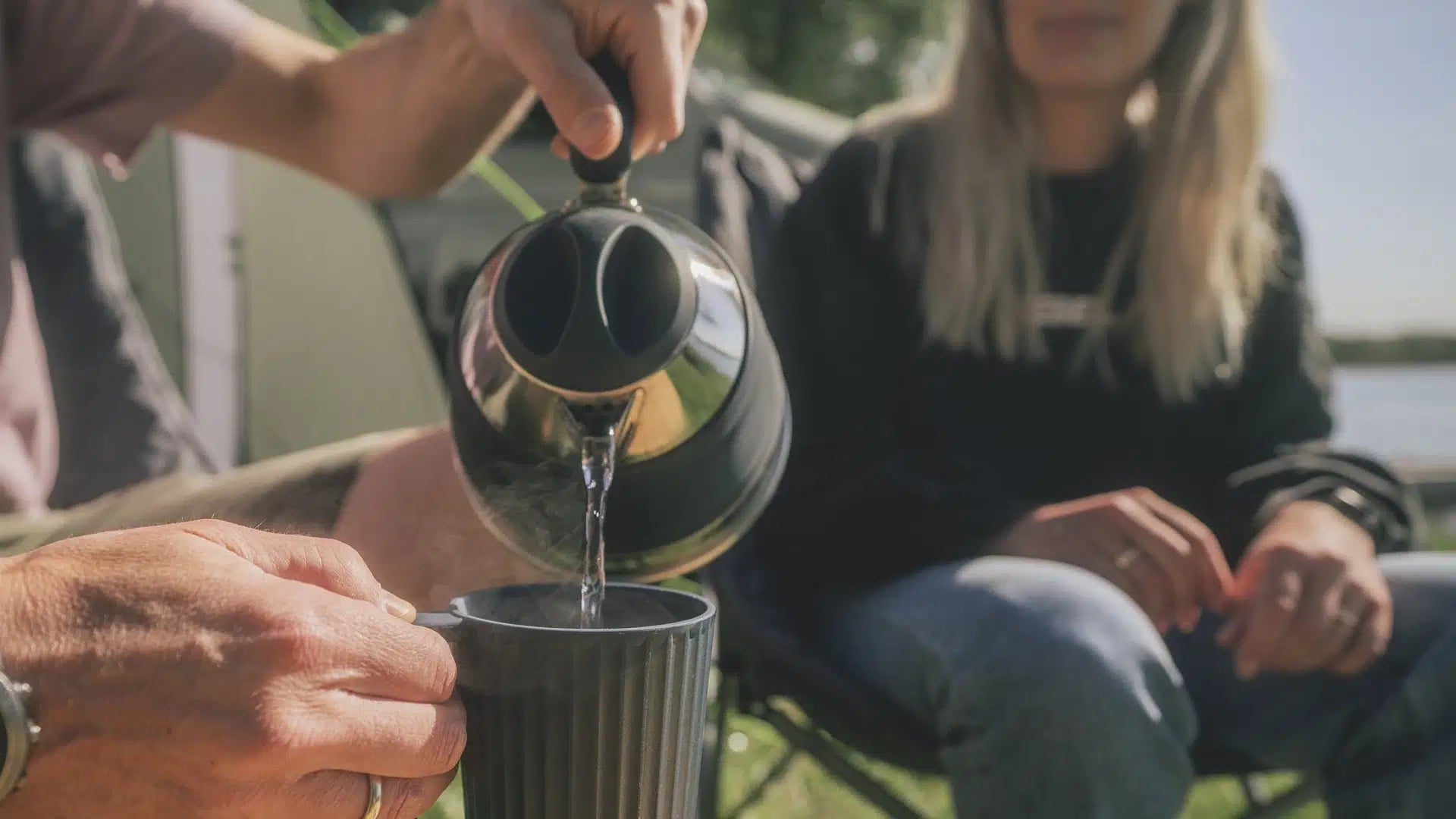 Outwell Collaps Kettle 1.5L in Shadow Green, a portable folding camping kettle for outdoor use, with a compact design.